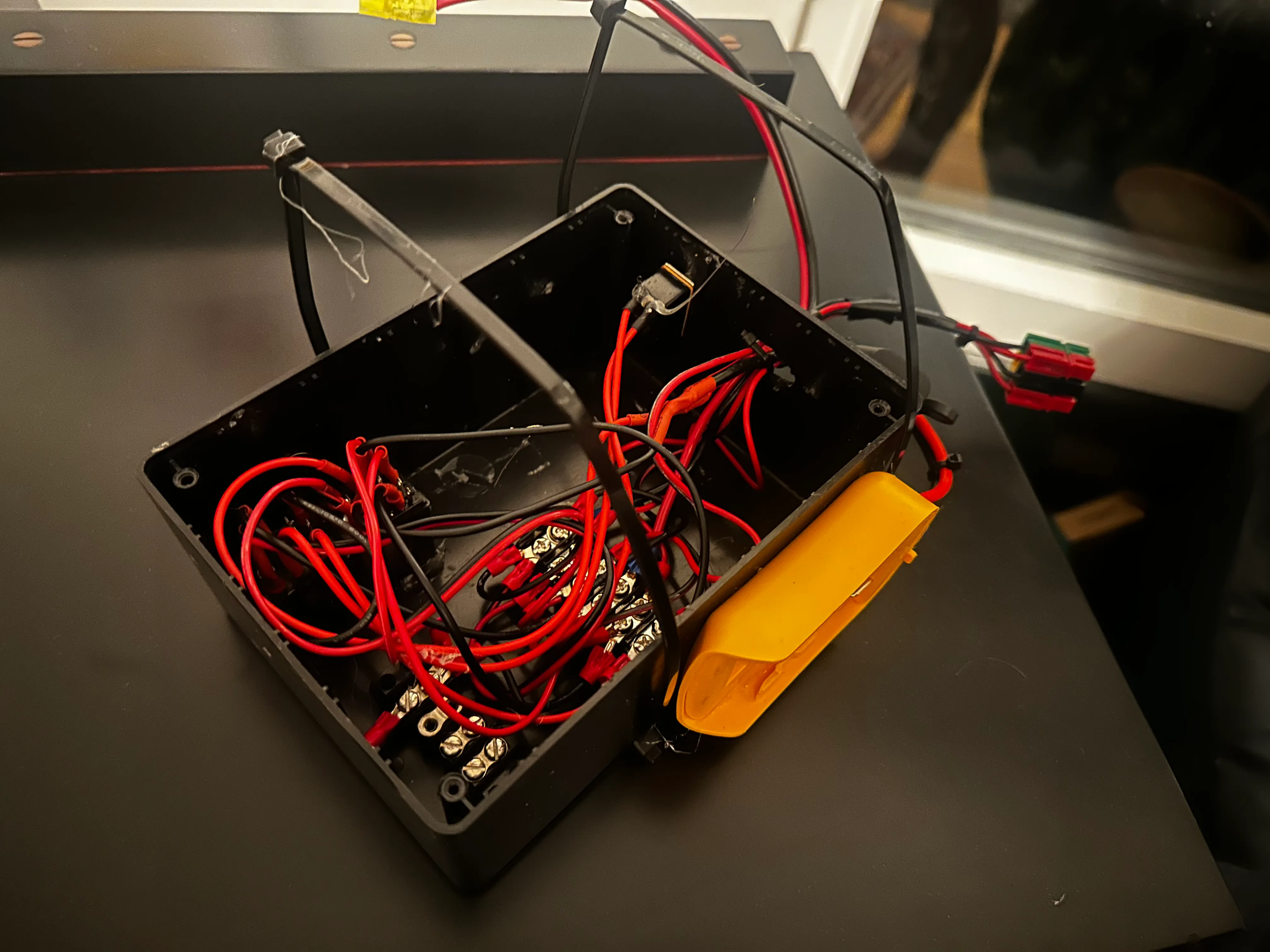 Image of wrist-mounted electromagnet and battery pack on table